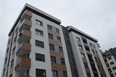 an apartment building with wood panels on it at Iskra in Banja Luka