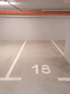 an empty parking lot with the number thirteen at Iskra in Banja Luka
