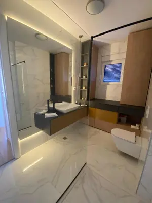 a bathroom with a sink and a toilet and a mirror at Exclusive BL apartments in Banja Luka