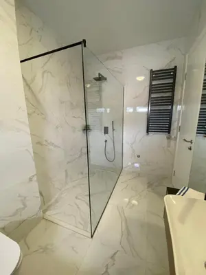 a bathroom with a shower with a glass door at Exclusive BL apartments in Banja Luka