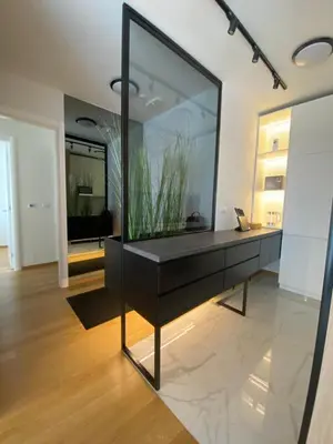 a living room with a large aquarium on a black dresser at Exclusive BL apartments in Banja Luka
