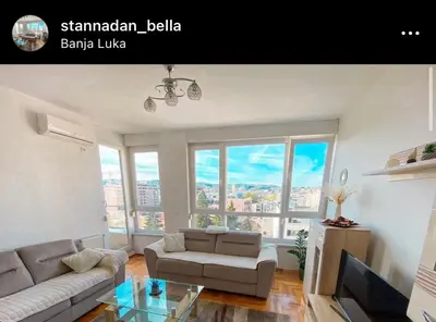 a living room with a couch and a table at Stan na dan Bella in Banja Luka