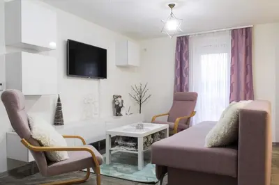a living room with a couch and chairs and a table at Villa Noa Kupres in Kupres