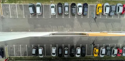 a bunch of cars parked in a parking lot at Orhidea Doboj in Doboj