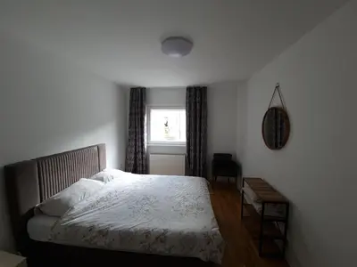 a bedroom with a bed and a window at VIP 2 Apartment in Visoko