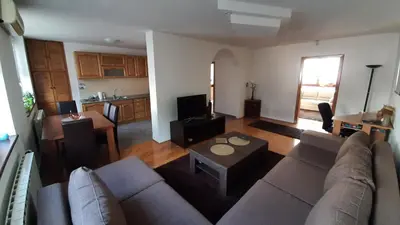 a living room with a couch and a table at Apartment Aurelio in Zenica