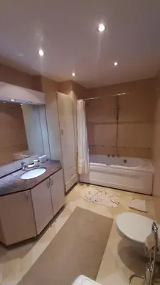 a bathroom with a sink and a bath tub at Apartment Aurelio in Zenica