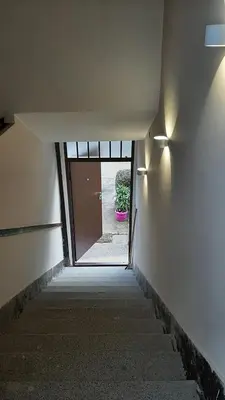 an empty hallway with a door and a plant at Apartment Aurelio in Zenica