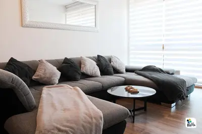 a living room with a couch and a table at Apartman Anđela in Kupres