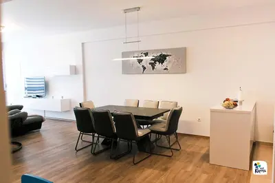 a dining room with a table and chairs at Apartman Anđela in Kupres