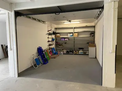 a garage with a door open to a room at Apartman Anđela in Kupres