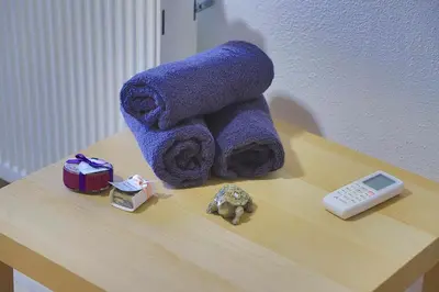 a pile of towels sitting on top of a table at Villa Lena in Bihać