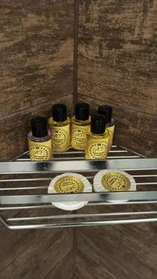 a group of five mustard bottles on a shelf at Apartmani President III in Banja Luka