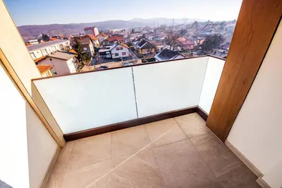 a balcony with a view of a city at Zlatna Kruna in Banja Luka
