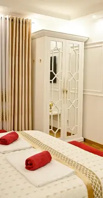 a bedroom with two beds with red pillows on them at Luxury Apartment Karic FREE parking in Tuzla