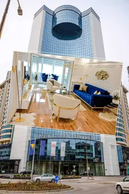 two pictures of a building with blue furniture in front of it at Luxury Apartment Karic FREE parking in Tuzla