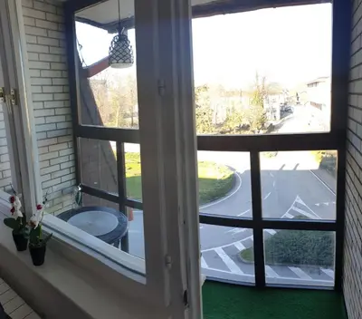 a window with a view of a street at Apartman Hana in Sanski most