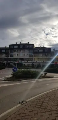 a blurry picture of a street with a building at Apartman Hana in Sanski most