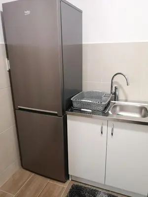 a refrigerator in a kitchen with a sink at Apartman Merkator in Banja Luka
