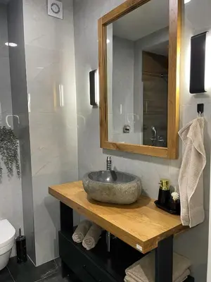 a bathroom with a sink and a mirror at Emma Park Lake Emma Parklake in Tuzla