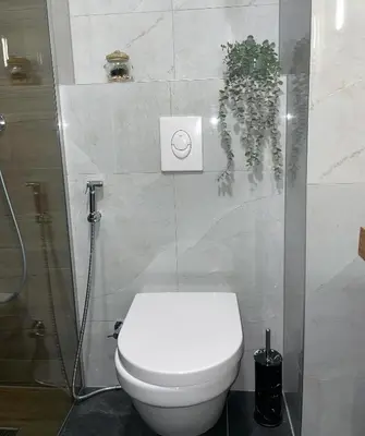 a bathroom with a white toilet and a shower at Emma Park Lake Emma Parklake in Tuzla