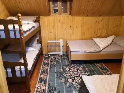 a room with two bunk beds and a radiator at Vikendica Ajla in Travnik