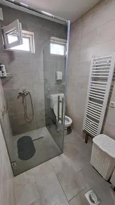 a bathroom with a shower and a toilet at Apartman Bubic in Banja Vrućica