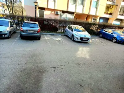 a group of cars parked in a parking lot at Stan na dan Centar Banja Luka in Banja Luka