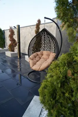 a dog bed sitting on top of a patio at Villa Vidovic Banja Luka in Banja Luka