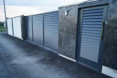 a row of garage doors on the side of a building at Villa Vidovic Banja Luka in Banja Luka