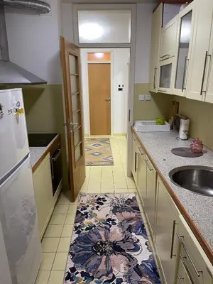 a kitchen with a sink and a counter top at Apartment Host in Tuzla