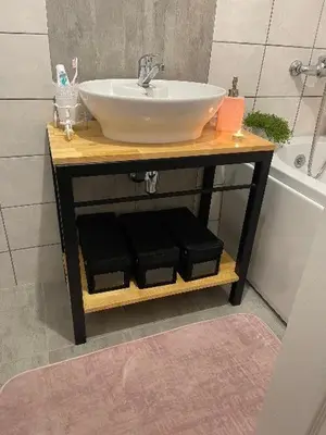 a bathroom with a sink on a wooden table at Bajka na dan two bedroom apartment in Bosanska Gradiška