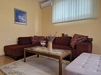 a living room with a couch and a table at Apartment Studenac in Banja Luka
