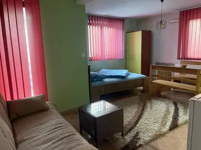 a living room with a couch and a bed at Sandy Vlašić in Vlasic