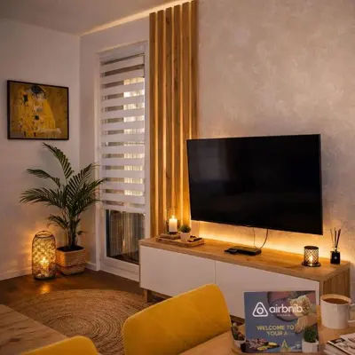 a living room with a large flat screen tv at Muki Park Lake in Tuzla