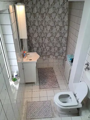 a bathroom with a toilet and a sink at Apartments Arna in Visoko