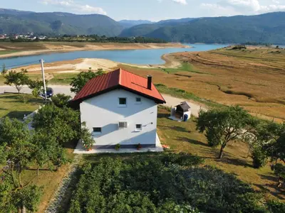 an aerial view of a white house with a red roof at Vikendica Bošnjak in Prozor