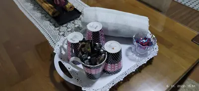 a white table with several containers of candy on it at Apartman House Jasmina in Bihać