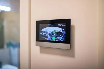 a television on a wall in a room at Apartman EpiLux in Tuzla