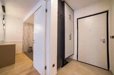 an open door in a room with a hallway at Apartman EpiLux in Tuzla