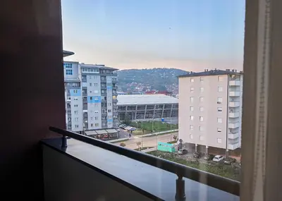 a balcony with a view of a city with buildings at Apartman Royal 3 in Doboj