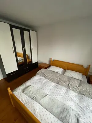 a bedroom with two twin beds and two mirrors at Apartman Antonia in Kupres