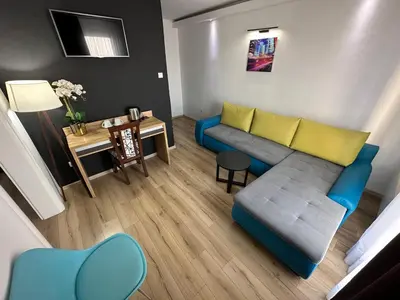 a living room with a couch and a table at Business Hotel Prijedor in Prijedor