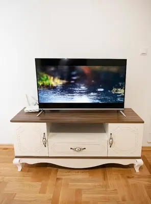 a flat screen tv on a white entertainment center at Apartman Venezia in Banja Luka
