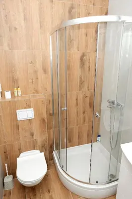 a bathroom with a shower and a toilet at Apartman Venezia in Banja Luka