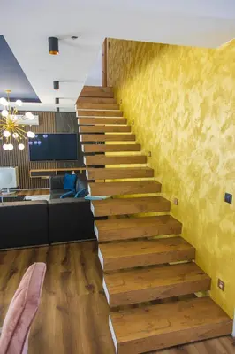 a staircase in a room with a yellow wall at Lohovo Villa Bukva in Otoka