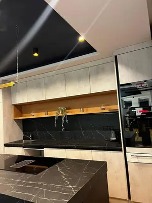 a kitchen with a black counter top in a room at Lohovo Villa Bukva in Otoka
