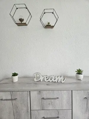 a table with two potted plants on top of it at Apartman Aladin in Bihać