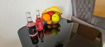 two bottles of soda and a basket of fruit in a refrigerator at VISOKO Room in Visoko