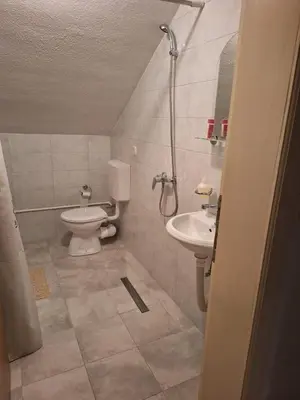 a bathroom with a toilet and a sink at VISOKO Room in Visoko